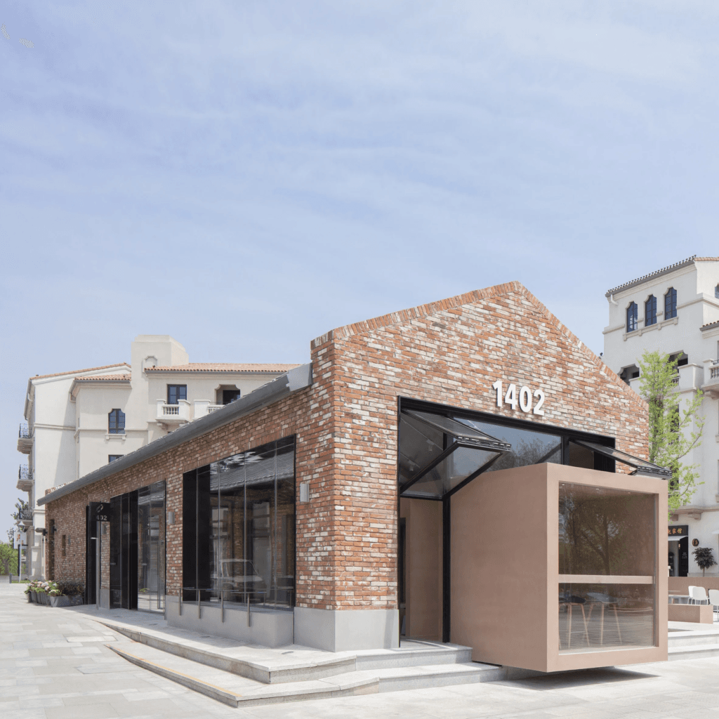 BLUE Architecture adds rectangular coffee shop to red brick building in China